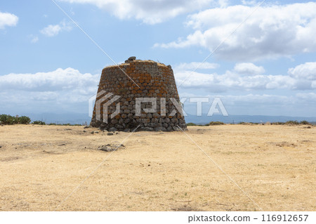 Ancient Nuraghe Tower in Sardinian Landscape. Ancient Nuraghe Tower in Sardinian Landscape. 116912657