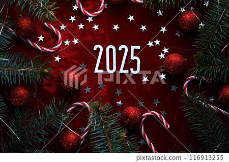 New Year red 2025 background. Number of the coming year in Christmas decoration. 116913255