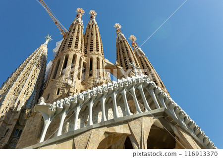 La Sagrada Familia Catalan Cathedral. Vertical view on the biggest cathedral in the world made by famous architecture Antonio Gaudi. Concept of travel, tourism and vacation La Sagrada Familia Catalan Cathedral. Vertical view on the biggest cathedral in the world made by famous architecture Antonio Gaudi. Concept of travel, tourism and vacation 116913370