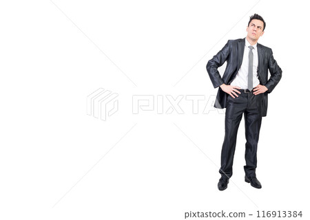 Thoughtful man in formal suit keeping hands on waist Thoughtful man in formal suit keeping hands on waist 116913384