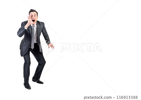 Businessman announcing news and shouting in studio Businessman announcing news and shouting in studio 116913388