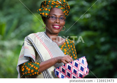 close up of young african woman, happy. 116913473