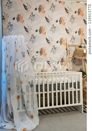 Shot of a bed in a modern baby room. Shot of a bed in a modern baby room. 116913778