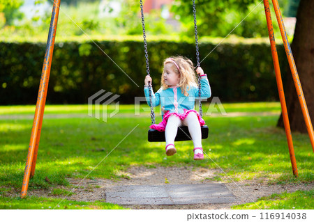 Kids explore nature. Children play in sunny park. 116914038