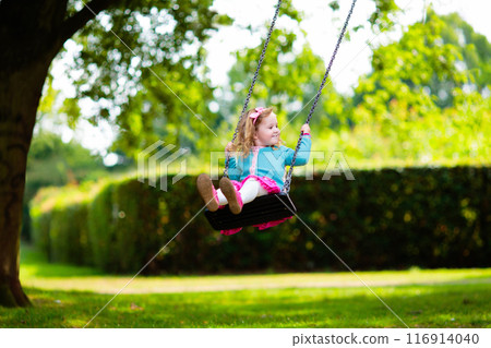 Kids explore nature. Children play in sunny park. 116914040