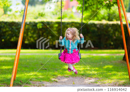 Kids explore nature. Children play in sunny park. Kids explore nature. Children play in sunny park. 116914042