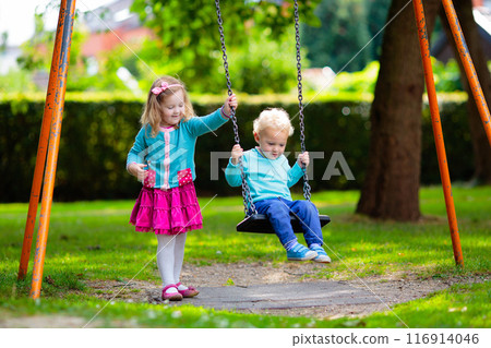 Kids explore nature. Children play in sunny park. Kids explore nature. Children play in sunny park. 116914046