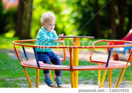 Kids explore nature. Children play in sunny park. 116914050