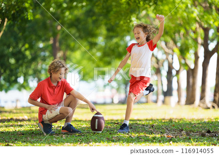 Family playing American football. Kids play rugby 116914055