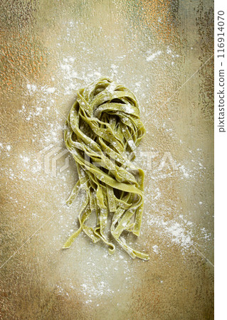 raw tagliatelle pasta, with spinach, homemade, top view, no people, rustic style, cooking concept, 116914070