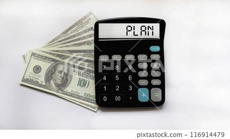 Calculator with word PLAN on dollars - Business management concept 116914479