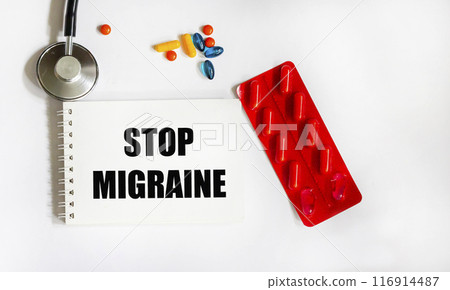 Notepad with Stop Migraine inscription, medical concept Notepad with Stop Migraine inscription, medical concept 116914487