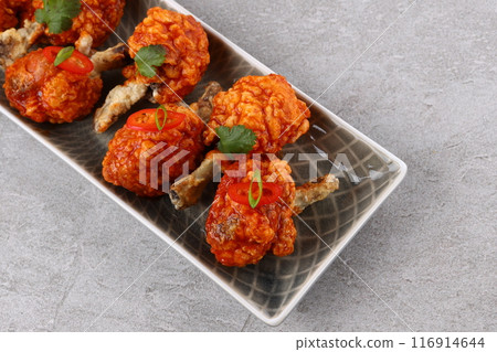 Grilled chicken wings with vegetable and spices flat lay on white background, food ideas concept Grilled chicken wings with vegetable and spices flat lay on white background, food ideas concept 116914644