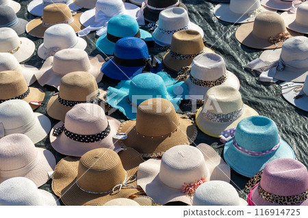 Colorful Sun Hats Displayed at Market Colorful Sun Hats Displayed at Market 116914725