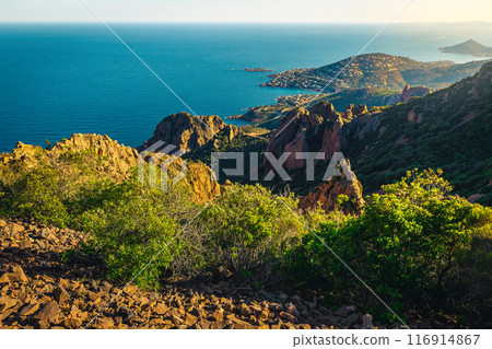 Blue sea and red rocks in the Esterel massif, France Blue sea and red rocks in the Esterel massif, France 116914867