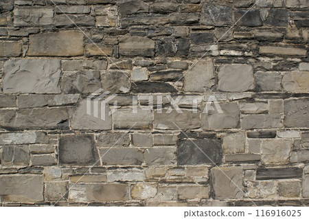 Background, wall fragment. Decorative wall made of natural stones.  116916025