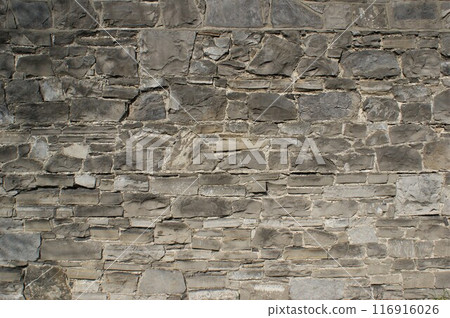 Background, wall fragment. Decorative wall made of natural stones.  116916026