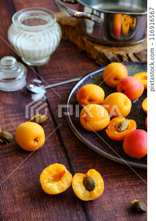 yellow ripe apricots on a plate 116916567