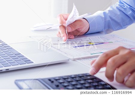 Image of a financial professional managing finances 116916994