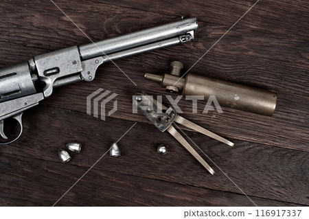 Antique old west bullet mold with bullets for revolver. 116917337