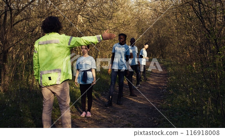 As the mission for the lost individual grows worse, supervisor of the rescue operation team guides his crew into the forest in search of clues. People screaming for missing person's name. Camera B. As the mission for the lost individual grows worse, supervisor of the rescue operation team guides his crew into the forest in search of clues. People screaming for missing person's name. Camera B. 116918008