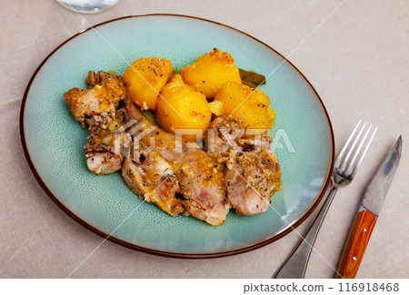 Chopped rabbit stewed in gravy with potatoes for dinner Chopped rabbit stewed in gravy with potatoes for dinner 116918468