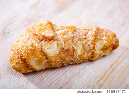 Catalan sweet bun with icing and sugar. Spanish dish Catalan sweet bun with icing and sugar. Spanish dish 116918471