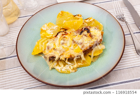 Appetizing pork with cheese and boiled potatoes on plate 116918554