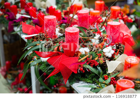 Decorative christmas candles in home goods store 116918877