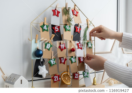 Step by step instruction of making handmade Christmas advent calendar. Creative craft homemade decor. New year celebration. Winter Step by step instruction of making handmade Christmas advent calendar. Creative craft homemade decor. New year celebration. Winter 116919427