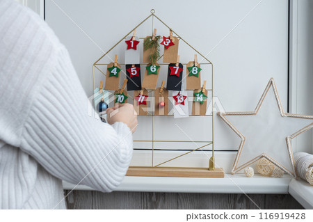 Traditional twenty four days advent calendar before Christmas holidays. Plastic free zero waste sustainable decoration. Winter cozy home Catholic traditions of Christmas countdown new year Traditional twenty four days advent calendar before Christmas holidays. Plastic free zero waste sustainable decoration. Winter cozy home Catholic traditions of Christmas countdown new year 116919428