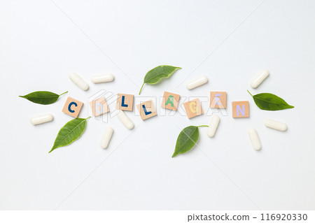 Inscription collagen on wooden cubes with leaves and pills Inscription collagen on wooden cubes with leaves and pills 116920330