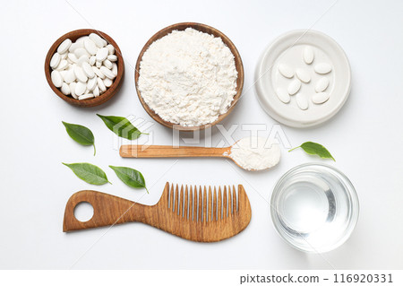 Collagen in powder and tablets with a wooden comb Collagen in powder and tablets with a wooden comb 116920331