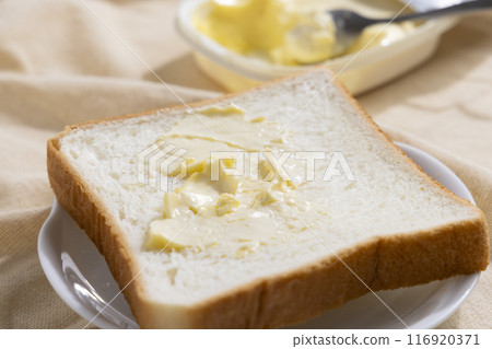 3 servings of margarine on bread 116920371