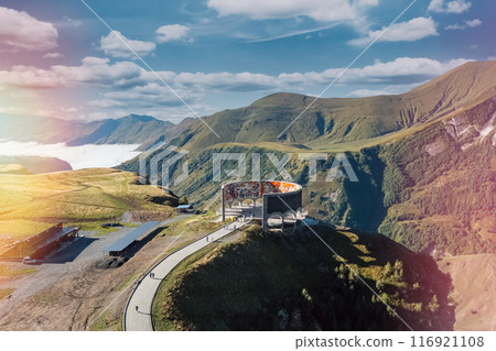 Monument of friendship of nations in Georgia. Stunning aerial view of a unique mountain structure overlooking a breathtaking landscape Monument of friendship of nations in Georgia. Stunning aerial view of a unique mountain structure overlooking a breathtaking landscape 116921108