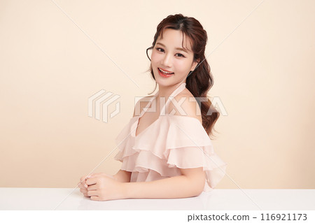 Beautiful young asian woman with clean fresh skin on beige background, Face care, Facial treatment, Cosmetology, beauty and spa, Asian women portrait. 116921173