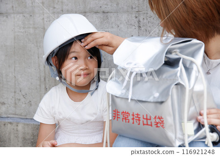 Image of a mother worrying about her child. Disaster prevention, mental care during disasters, and the onset of illness 116921248
