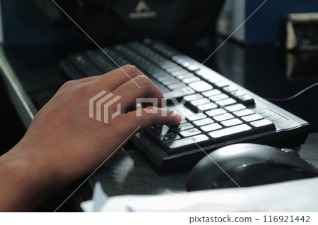 Hands of an office man typing Hands of an office man typing 116921442