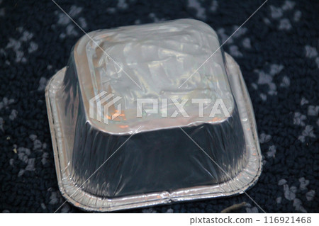 Upturned aluminum cake mold on carpet background Upturned aluminum cake mold on carpet background 116921468