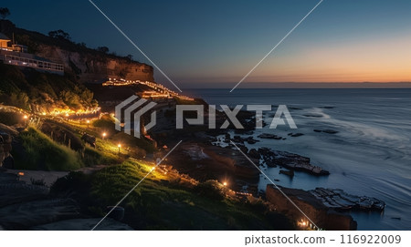 A scenic cliffside with shimmering lights sets the stage for an enchanting coastal light festival. 116922009