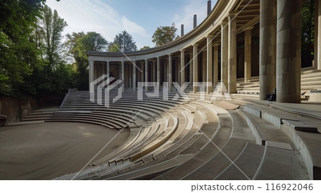 An open-air classical amphitheater with grand columns and an empty stage awaits a live orchestra. An open-air classical amphitheater with grand columns and an empty stage awaits a live orchestra. 116922046
