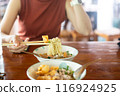 Woman hands holding delicious egg noodle with chopsticks 116924925