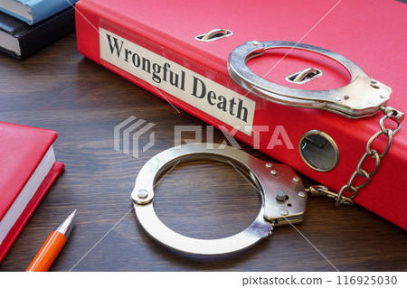 Folder about wrongful death and handcuffs. 116925030