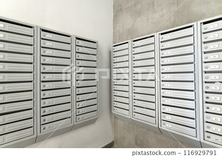 mailboxes in interior of entrance group of residential high-rise building, Russia 116929791