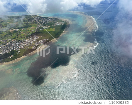 Coastline seen from the sky. Sea, beach, and coral reefs of Japan, Okinawa, and remote islands from above. Coastline seen from the sky. Sea, beach, and coral reefs of Japan, Okinawa, and remote islands from above. 116930285