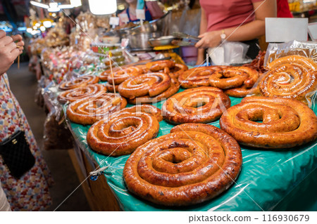 Sai Aua, Northern Thailand Spicy Sausage is a famous Traditional Local saurage cooked with curry and herb, lay on shop and ready for sales. Sai Aua, Northern Thailand Spicy Sausage is a famous Traditional Local saurage cooked with curry and herb, lay on shop and ready for sales. 116930679