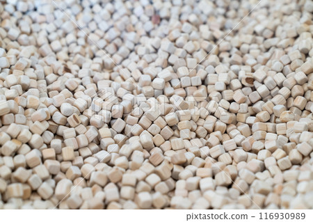 A plenty of small wooden cubes are full filled in a kid playground area for the child's background. A plenty of small wooden cubes are full filled in a kid playground area for the child's background. 116930989