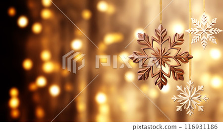 Eco friendly Christmas. Homemade xmas ornament and blurred lights at backdrop. Ecology, environmental conservation, zero waste concept. Horizontal holiday banner with wood snowflakes and glowing bulbs 116931186