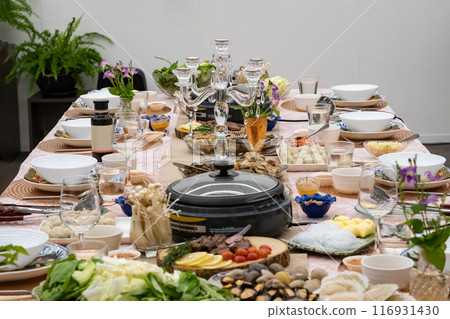 Sukiyaki Premium and Luxury Dinner Set for Celebration with special VIP guests. They have the raw material, beef, pork, chicken, egg, tofu, vegetable, shrimp, shell, squid. 116931430