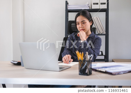 Businesswoman is thinking and is stressed about work. Businesswoman is thinking and is stressed about work. 116931461